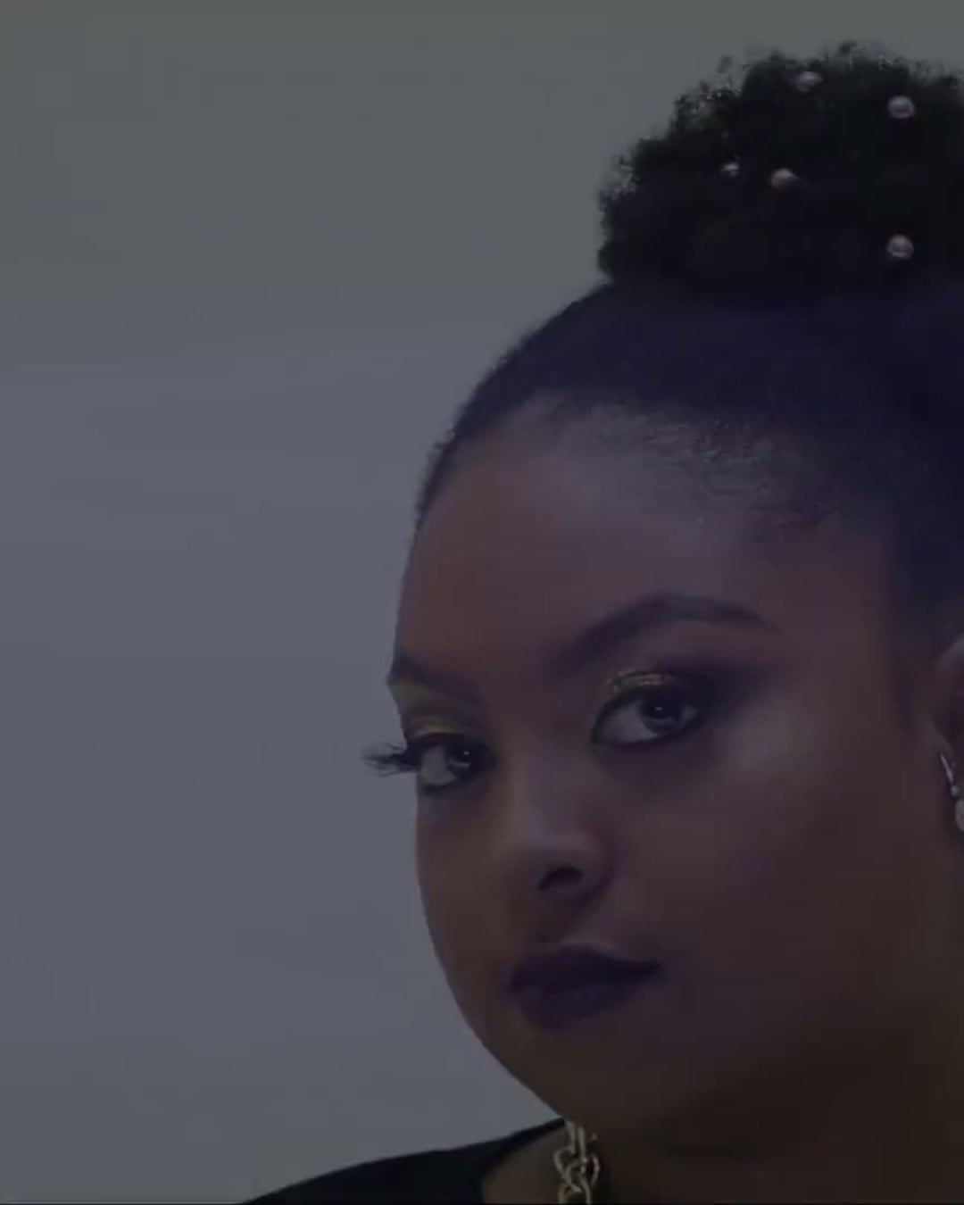 Beautiful diverse woman with healthy, styled hair using premium hair care products